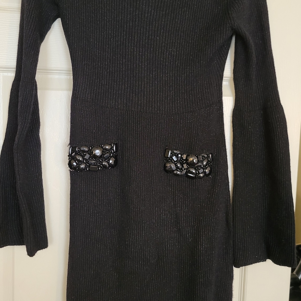 Elegant Black Dress with Embellished Pockets